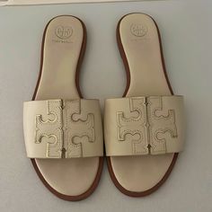 Size 8 Cream Tory Burch Sandals. Barley Worn. Great Condition. Classic Closed Toe Cream Sandals, Classic Cream Closed Toe Sandals, Chic Cream Flat Sandals, Classic Beige Slip-on Sandals, Beige Classic Slip-on Sandals, Classic Beige Sandals With Round Toe, Beige Classic Sandals With Round Toe, Classic Cream Leather Sandals, Classic Beige Sandals For Spring