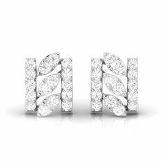 Platinum Diamond Earrings by Jewelove Cute platinum earrings designed with diamonds. Metal : Platinum Platinum Purity : 95% Purity Mark : Pt 950 Estimated Platinum Weight : 1.91 grams Estimated Diamond Weight : 0.28 cts. Diamond Color : IJ or GH (as selected above) Diamond Clarity : SI or VVS (as selected above) Diamond Grading Report : SGL Certificate of Authenticity : Platinum Guild International please call us at +91-9828012999 or email us at WeCare@Jewelove.in Modern White Diamond Earrings For Anniversary, Platinum Cluster Earrings With Diamond Accents, White Platinum Cluster Earrings With Diamond Accents, White Platinum Cluster Earrings For Anniversary, White Diamond Cut Platinum Cluster Earrings, White Diamond Cut Earrings For Formal Events, Modern White Diamond Cut Earrings, Formal White Diamond Earrings, Modern White Diamond Earrings