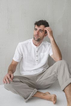 "DETAILS: * Classic shorts sleeve mens shirt * Straight shape with pressed classic collar * Natural coconut buttons to the middle at the front shirt  * Ideal for every occasion * Made from soft wash medium weight (185 gsm) 100 % European linen fabric * Height of the model is 182 cm (5'12″) and he is wearing size L  * Color - white. Please choose another color and size on the right * Product number: MT008 CARE LABEL * machine wash gentle (40 C/104 F) * dry gentle on low heat * wrinkles give the character so there is no need to iron, but if you still prefer it - iron at low heat SIZING S BODY / Recommended body measurements for the size S: - chest in 96 cm / 38\" - neck in 37.1 cm / 14.6\" - arm length in 56 cm / 22\" M BODY. Recommended body measurements for the size M: - chest in 100 cm / Classic Short Sleeve Button T-shirt, Mens Linen Shirt Short Sleeve, Relaxed Fit Short Sleeve Button T-shirt, White T-shirt With Buttons Relaxed Fit, Pure Linen Shirts Men, White Short Sleeve T-shirt With Buttons, Solid Linen Button-up Shirt, Linen Shirt Outfit Men’s Beach, White Relaxed Fit T-shirt With Buttons