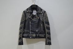 ♣ Product Description:    We have brought you this stylish Handmade Studded Punk Jacket made with the genuine best quality of Leather. This Men's Studded leather Jacket has been inspired by Heavy metal fashion wears and is designed for Motorcycle bikers and Rockstars. This Studded Punk Jacket has cool studs that gives it the killer looks. Having asymmetrical Brando zipper closure gives it incredibly astonishing feel. Buy this Men's Studded Leather Jacket for yourself and get commendations by your fellows.  When you look at this jacket, all you can think of is a rockstar. This is precisely what this biker black studded leather jacket is all about. If there is one thing we can say about this jacket, it is that this is definitely for the faint of heart. This flashy number is as majestic as it Punk Style Studs Leather Jacket For Biker Events, Punk Leather Jacket With Studs For Biker Events, Edgy Studded Leather Jacket For Biker Events, Edgy Studded Leather Jacket For Biker, Edgy Studded Leather Jacket For Streetwear, Fitted Studded Biker Jacket For Streetwear, Studded Fitted Biker Jacket For Streetwear, Punk Biker Jacket With Studs For Streetwear, Punk Studded Biker Jacket For Streetwear