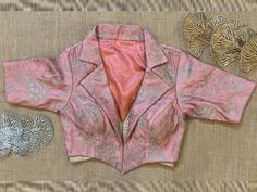 Buy stunning pink embroidered collar blouse online in USA. Elevate your saree style with exquisite readymade saree blouses, embroidered saree blouses, Banarasi sari blouse, designer saree blouse, choli-cut blouses, corset blouses from Pure Elegance Indian fashion store in USA.-front Floral Embroidered Blouse With Collar, Designer Embroidered Collared Tops, Traditional Pink Blouse Piece With Padded Blouse, Designer Floral Embroidered Tops For Formal Occasions, Designer Formal Tops With Floral Embroidery, Formal Pink Blouse Piece With Zari Work, Designer Padded Pink Blouse Piece, Designer Pink Padded Blouse Piece, Pink Padded Blouse Piece For Festivals