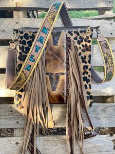 "Please read full description for instructions on ordering Purse is made to order This beautiful handmade crossbody is made with genuine cowhideand 12\" fringe on both sides. You have two options for the strap. A leopard cowhide. That matches the purse or a custom tooled strap. Please choose at check out. The custom tooled straps are 1.5 inch wide and we use 5/6 ounce veg tan leather. Approximately 11x11 inch Zipper closure Pocket on the inside Sunflower lining in seller notes please let me know Country Purses, Dark Western, Western Bags Purses, Western Bags, Fringe Crossbody Purse, Nashville Outfit, Truck Diy, Western Bag, Custom Purses