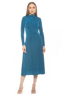 An elegantly draped funnel neck and gathered waist highlight a charming fit-and-flare dress constructed with comfortable stretch. 51 1/2" length Hidden back-zip closure Funnel neck Long sleeves Partially lined 97% polyester, 3% spandex Machine wash, line dry Imported Evening Dress With Ruched Fitted Waist, Fitted Midi Dress With Ruched Bodice For Fall, Cocktail Dresses With Gathered Waist And Fitted Style, Fitted Cocktail Dress With Gathered Waist, Fitted Dresses With Gathered Waist For Cocktail, Evening Ruched Dress With Fitted Waist, Fitted Pleated Draped Midi Dress, Fitted Midi Dress With Pleated Bodice, Fitted Draped Dress With Pleated Waist