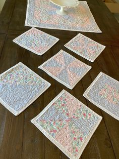 the table is covered with quilted placemats