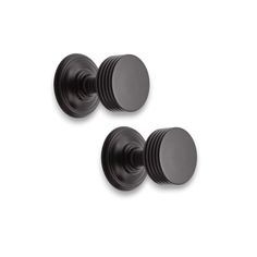 two black door knobs on a white background