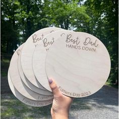 four wooden coasters with the words best dad and father's day written on them