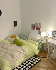 a bedroom with a bed, desk and chair