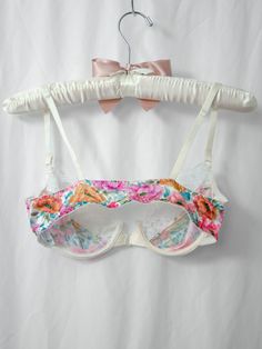 Floral nylon with bright white lace. Underwire. Adjustable straps and single front hook closure. SIZE NOTES Tag reads size 34B. Seems to fit true to size. Seen on 5’2, 34” bust, 28.5” waist, 41” hip CONDITION Excellent vintage condition, no major flaws to note. Fitted Underwire Bra With Straps, White Lace Bra With Adjustable Straps, White Fitted Nylon Bra, Fitted White Nylon Bra, White Nylon Bra, Summer Lace Bra With Padded Cups, White Underwire Bra With Lace Trim, Fitted Full Coverage Bra With Straps, White Lace Underwire Bra