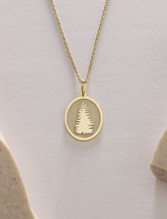 Gold Evergreen Tree Pendant - Tree of life Gold Necklace ● Material of pendant: Solid Gold 14k ( REAL GOLD ) ● Metal Stamp: 14k ( REAL GOLD ) ● The pendant is available in 5 sizes: - 12x17 mm / 0,47 x 0,66 inches - 13x18 mm / 0,51 x 0,70 inches  In the photos - 14x19 mm / 0,55 x 0,74 inches  - 16x21 mm / 0,62 x 0,82 inches  - 18x24 mm / 0,70 x 0,94 inches ( In the photos the size is 13x18 mm / 0,51 x 0,70 inches ) ( Jump Ring inner diameter: 4 mm ) ● Material of chain: Solid gold 14k ( REAL GOLD ) It is thin and dainty and it is available in 4 sizes: - 40 cm / 15,75 inches ( Length ) - 45 cm / 17,72 inches ( Length ) In the photos - 50 cm / 19,68 inches ( Length ) - 55 cm / 21,65 inches ( Length ) ● Backside engraving is FREE ( Please use the personalization box for that.) ● If you want la Gold Tree, Tree Necklace, Evergreen Trees, Gold Birthday, Tree Pendant, Jump Rings, Metal Stamping, Real Gold, Necklace Gold