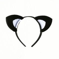 a black and white cat ears headband on a white background