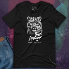 a black t - shirt with an image of a tiger on it