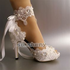 white bridal shoes with lace and pearls