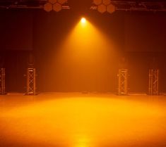 an empty stage with lights and spotlights