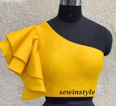 1. Fabric - Silk. 2. One shoulder blouse. 3. Bell sleeves blouse. 4. Customize in any color and size. One Shoulder Blouse Pattern, Bell Sleeves Blouse Indian, One Shoulder Blouse Designs, Bell Sleeve Blouse Design, Bell Sleeves Blouse, Blouse Bell Sleeves, Smart Outfits, Blouse Tops Designs, Blouse Indian