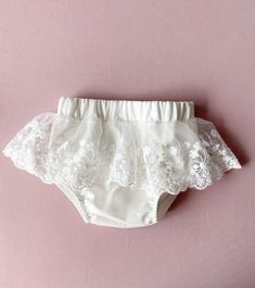 Ivory baby girl bloomers. The fabric is  natural cotton. You can order all matching baptism out: dress, headband, shoes. Please, use the links: *dress: https://www.etsy.com/listing/1462594915/baptism-dress-for-baby-girl-christening?click_key=016383318fba970c06c0fcf867711d818790fd98%3A1462594915&click_sum=f7ffb1fd&ref=shop_home_active_1&frs=1&sts=1 *headband: https://www.etsy.com/listing/1462604251/christening-headband-lace-bow-ivory?click_key=71867b64df5cee90583fc6a9a97439f613ed7c46%3A1462604251&click_sum=71da5b62&ref=shop_home_active_1&frs=1&sts=1 *shoes: https://www.etsy.com/listing/1462601197/ivory-baptism-shoes-christening-booties?click_key=b6c66491f006a0ea975d24fcb95094905e0285b3%3A1462601197&click_sum=39c96ce3&ref=shop_home_active_1&frs=1&sts=1 Wash & care instructions: Steam out the White Lace Ruffled Bottoms, White Lace Baptism Dress With Ruffles, White Lace Bottoms For Weddings, White Lace Wedding Bottoms, Summer Baptism Dress With Lace Work, Cute Lace Baptism Dress, Cute Lace Baptism Dress With Lace Trim, White Elegant Baptism Dress For First Birthday, Elegant White Baptism Dress For First Birthday