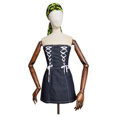 Gorgeous Y2k Vintage Dolce & Gabbana corseted, strapless mini dress ! Crafted in a Dark blue stretchy denim with contrasting white lace-up details. MADE IN ITALY ! Features: zip up back with silver hardware Fitted waist Mini length adjustable white lace up details Sizing given in inches: Bust: 31'' Waist: 26'' Shoulder to Hem: 23'' Recommended Size: UK 6 - 8 / XS-S Condition 9/10 Dolce Gabbana Dress, Corset Mini Dress, Dark Blue Denim, Strapless Mini Dress, Dolce & Gabbana, Dark Denim, Y2k Vintage, Day Dresses, White Lace