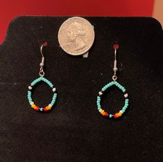 Small western teal beaded earrings, lightweight and hypoallergenic :) Handmade with seed beads and beading wire. Southwestern Green Beaded Dangling Earrings, Turquoise Teardrop Earrings With Tiny Beads, Southwestern Turquoise Beaded Earrings, Southwestern Style Turquoise Beaded Earrings, Turquoise Dangle Beaded Earrings With Tiny Beads, Turquoise Beaded Teardrop Hoop Earrings, Turquoise Drop Beaded Earrings With Tiny Beads, Adjustable Beaded Turquoise Teardrop Earrings, Turquoise Beaded Earrings With Ear Wire