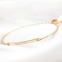 ✨ 14K Solid Gold Dainty Bar Bracelet - Elegance in Simplicity ✨ 💎 Attention: Looking for a timeless, elegant accessory that speaks to the heart? This ultra dainty 14K solid gold bar bracelet is the perfect piece to celebrate your most precious moments. Whether it's a name, a meaningful date, or Roman numerals, this personalized bracelet is crafted with you in mind. 🌟 Interest: Handmade with care from 100% real 14K gold, this minimalist bracelet is not just beautiful--it's designed to last! Lig Dainty Gold-plated Name Bracelet, Minimalist Rectangular Gold Name Bracelet, Minimalist Personalized Rectangular Bracelet, Minimalist Gold Name Bracelet, Rectangular, Everyday Personalized 14k Gold-filled Name Bracelet, Lingot D'or, Gold Bar Bracelet, Bar Bracelets, Minimalist Bracelet