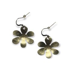 These brushed textured brass earrings add a pop to any outfit. Drop earrings with a simple flower shape. Springtime are in the air. Details: Hook fastenings for pierced ears. Size: Length of drop: ~ 1.6" (4 cm), widest portion: ~ 1.2" (3 cm) Material: brass, silver plated brass Simple Floral Design, Cutout Style, Simple Flower, Simple Flowers, Dangling Earrings, Brushed Metal, Metal Earrings, Brass Earrings, Pierced Ears