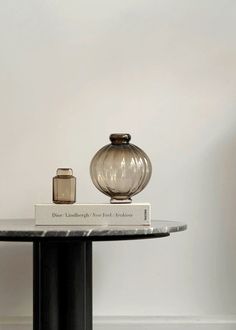 a table with two vases on top of it