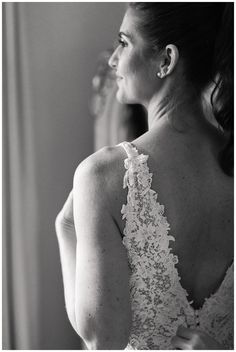 the back of a woman's dress in black and white