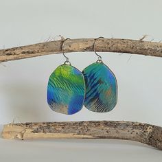 Artistic Design Drop Earrings, Unique Artistic Drop Earrings, Artisan Blue Earrings, Artsy Blue Metal Jewelry, Green Artistic Dangle Earrings, Artsy Blue Dangle Earrings, Artistic Blue Earrings As Gift, Unique Blue Metal Earrings, Artistic Hand-painted Turquoise Jewelry