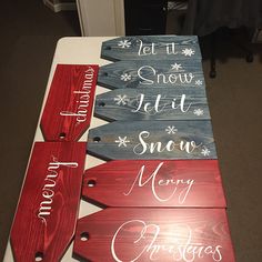 three wooden signs that say let it snow, merry christmas and let it snow written on them