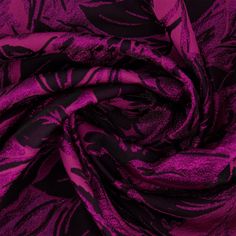 a purple and black floral print fabric