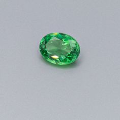 Say "Tsavorite" -- it's named for the mine where it was discovered in Tsavo, Kenya. The brilliant fire and intense green color are captured perfectly in this classic oval cut. The generous carat-size would lend itself to an impressive ring for a second wedding anniversary or a January birthday. Especially explosive when matched with white diamonds in white gold -- call us to discuss and design.Gemstone Details Identification: Natural Garnet Carat: 3.21 Carats Shape: Oval Color: Green Measurement Classic Oval Tsavorite Emerald Ring, Oval Green Gemstones For Formal Occasions, Gia Certified Green Oval Emerald Ring, Gia Certified Oval Green Emerald Ring, Gia Certified Oval Emerald Ring, Gia Certified Oval Green Gemstones, Oval Green Tsavorite Jewelry, Second Wedding Anniversary, Second Wedding