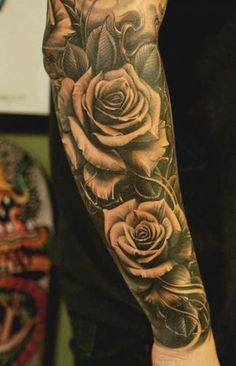 a man with a rose tattoo on his arm