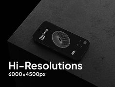 a cell phone sitting on top of a black table with the words hi resolutions