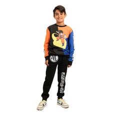 Gear up your young Saiyan with this officially licensed Dragon Ball Z youth 2-piece set. The pullover sweatshirt features a striking graphic of Goku, while the joggers showcase the title logo and add an authentic touch to the ensemble. Crafted with high-quality cotton and polyester materials, this 2-piece set ensures both comfort and durability, making it perfect for young fans to wear during their adventures and training sessions. Whether they're channeling their inner Super Saiyan or just hang Graphic Print Crew Neck Sweatshirt For Playwear, Cotton Graphic Print Sweatshirt For Playwear, Casual Long Sleeve Tracksuit For Playwear, Sportswear Tracksuit With Graphic Print And Long Sleeves, Graphic Print Sportswear Tracksuit, Graphic Print Long Sleeve Sportswear Tracksuit, Sporty Cotton Sweatshirt With Character Print, Casual Graphic Print Sweatshirt For Playwear, Graphic Print Long Sleeve Tracksuit