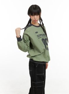 Product Detail Style : Street, Acubi Occasion : Back to school Type : Activewear Print : Graphic, Lettering Material : Nylon Sleeve : Long sleeve Neck : Crew Neck Fit : Loose fit Nylon100 Color : Black, Beige, Green Made in Korea Model Size Model is wearing size M/L and the color Green. Height : 5'7" | 171cm / Top : XS / Bottom : S (25 inch) .prddescription table, .prddescription td, .prddescription th { border : 1px solid black; border-collapse : collapse; padding: 10px; } Size(Inch) Size Shoul Winter Streetwear Tops With Raglan Sleeves, Sporty Long Sleeve Windbreaker For College, Sporty Long Sleeve College Windbreaker, Urban Style Long Sleeve Tops For Outdoor, Trendy Long Sleeve Windbreaker With Letter Print, Casual Letter Print Windbreaker For Streetwear, Casual Windbreaker With Letter Print For Streetwear, Oversized Long Sleeve Windbreaker For College, Cotton Long Sleeve Windbreaker Sportswear