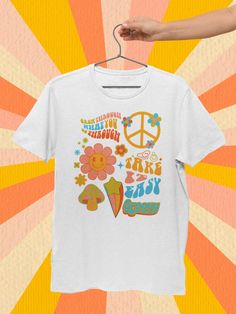 "Embrace the Retro Vibes with our Stay Groovy Shirt Collection! Get your groove on with these trendy Stay Groovy T-shirts, perfect for any groovy birthday party outfit or groovy party. Our Groovy Tee selection offers the perfect blend of vintage charm and contemporary style, making it a must-have for all the free-spirited souls out there. Express your inner hippie with our Stay Groovy Retro Tee, and let the world know you're all about peace, love, and good vibes. Don't miss out on this hip and s Groovy Short Sleeve T-shirt With Funny Print, Retro Short Sleeve Top For Birthday, Retro White Top For Birthday, Vintage White Top For Birthday, Retro Graphic Crew Neck Tee, Groovy Short Sleeve T-shirt With Retro Print, Groovy Short Sleeve Top With Graphic Print, Groovy Graphic Print Top With Short Sleeves, Groovy White Short Sleeve Tops