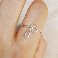 Delicate details make our Initial Ring in Silver a gorgeous addition to your finger! This beautiful piece is slim and trim, with a sweet cursive letter that lets you express yourself and to wear one on top of the other that make your look even more intriguing. This unique ring is made with gorgeous Sterling Silver for a beautiful shine that lasts. • Material: High Quality Sterling Silver 925, Gold Filled 12k, Rose Gold 12k• This ring is adjustable (you will receive it in the standard size US7, i Simple Adjustable Initial Ring, Personalized Initial Ring, Lowercase Letter, Gold N, Cursive Letters, Name Rings, Letter P, Initial Ring, Unique Ring