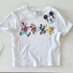 Primark Disney Mickey And Friends Shirt In Xs Trendy White Mickey Mouse Tops, Trendy White Tops With Mickey Mouse Design, Cute White Tops For Disney Trips, Cute Character Print Tops For Disney Trips, Disney White Tops With Character Print, Cute Tops With Character Print For Disney Trips, White Summer Top For Disney Trips, Cotton Mickey Mouse Tops For Disney Trips, White Mickey Mouse Top For Disney Trips