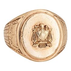 Finely detailed antique Victorian family crest signet ring (circa 1898), crafted in 10 karat yellow gold.   The oval signet mount features a family crest with the year '1898' to the base. The side shoulders feature a pretty etched foliate design. The low rise ring (3.5mm - 0.13 inches) sits comfortably on the finger.    The ring is in good condition with some wear evident. We have not cleaned it in order to preserve patina and collector value.   Particulars:  Weight: 13.5 grammes  Stones:  N/A Gold Signet Ring, Family Crest, Antique Victorian, Signet Ring, 10k Gold, A Family, Patina, Jewelry Rings, Yellow Gold