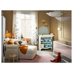 a baby's room with a crib, dresser and bed in it is shown