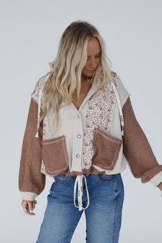 Embrace your boho style with the Leighton Button Up Floral Jacket. This will quickly become your go-to for all your daily actvites and weekend adventures! Comfortable, cozy thermal fabric with so cute contrast floral print and color block design Relaxed and loose button-up top silhouette (can be worn open as a layering piece or closed as a top with your fav boho bralettes!) Hoodie with so pretty floral pattern and quilted fabric Loose long sleeves with elastic cuffs Double contrast front patch p Thermal Fabric, Weekend Adventures, Quilted Fabric, Floral Jacket, Block Design, Layering Pieces, Boho Style, Bralette, Color Block