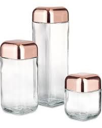 three glass jars with copper lids