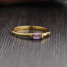 Metal : Solid Sterling Silver with 925 Stamp. Stone - Amethyst  Ring Size - US # 9 Ring Weight - 1.8 gm.  Stone Size - 3mmX5mm Baguette Silver Amethyst Ring, Minimalist Amethyst Birthstone Ring For Anniversary, Minimalist Amethyst Promise Ring, Minimalist Amethyst Birthstone Promise Ring, Dainty Amethyst Gemstone Stackable Rings, Minimalist Gold Amethyst Ring, Dainty Stackable Amethyst Ring Gift, Dainty Amethyst Stackable Rings For Gift, Minimalist 14k Gold Amethyst Ring As Gift