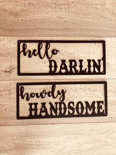 two metal signs that say hello, darlin and have the same words on them