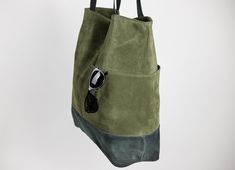 "Carry all your essentials in this minimalist & elegant oversized khaki tote bag. Handcrafted from soft and luxurious genuine suede leather that can be dressed down for day and up for night. Throw your cell, keys, tickets, and other small items in the spacious front pocket for easy access. Perfect for travel, shopping, and everyday use. Handcrafted in Seattle, USA ✂Features: + 100% genuine suede leather + Raw edges Straps: 100% soft natural black cow leather + One zippered pocket inside + On Khaki Tote Bag, Beige Tote Bag, Bag With Pockets, Tote Bag With Pockets, Soft Leather Tote, Beige Tote, Suede Tote Bag, Green Tote Bag, Everyday Tote Bag