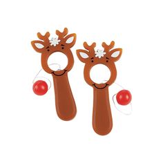 two wooden reindeers with red balls in their mouths