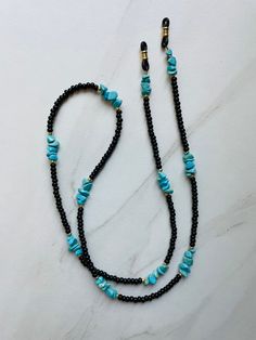 Everyday sunglasses chain. Perfect for outdoor adventure or a day by the pool. Blue Beaded Glasses Chain For Beach, Blue Glasses Chains For Beach Summer, Blue Glasses Chains For Summer Beach, Blue Glasses Chains For Beach In Summer, Black Jewelry With Adjustable Chain For Beach, Black Necklaces For Summer Vacation, Black Necklace For Summer Vacation, Blue Summer Glasses Chains, Black Summer Vacation Necklaces