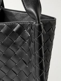 "When creating a Bottega Veneta bag, we count days, not hours, " says the brand. Artisans in Italy have handcrafted this messenger bag by meticulously weaving strips of leather in the signature intrecciato technique. It's roomy enough to carry your tablet, water bottle and a hard case for your sunglasses. Luxury Satchel With Braided Handles, Luxury Bucket Bag With Top Carry Handle For Business, Luxury Business Bucket Bag With Top Carry Handle, Modern Leather Shoulder Bag With Intrecciato Weave, Modern Leather Satchel With Intrecciato Weave, Luxury Woven Leather Bag With Double Handle, Classic Woven Leather Tote Shoulder Bag, Luxury Tote Shoulder Bag With Braided Handles, Luxury Double Handle Woven Leather Bag