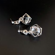 Unusual, sparkly diamond shaped crystals are captured in silver plated cages. I have joined them to the crystal, non allergenic, stainless steel posts with chain maille. Nice neutral earrings will go with anything. Makes a lovely gift. Here is a link to my whole shop: https://www.etsy.com/shop/designsbymalone RETURNS - BUY WITH CONFIDENCE Don't worry, I will refund or exchange an item up to 60 days. Makes gift giving easy! All my items will arrive in a gift box and/or a velvet or organza pouch. Silver Crystal Earrings With Sparkling Stones For Gift, Clear Pierced Jewelry For Party, Diamond White Pierced Party Earrings, Party Crystal Earrings For Pierced Ears, Party Clear Crystal Earrings For Pierced Ears, Party Earrings With Clear Metal, Silver Sparkling Crystal Earrings For Gift, Silver Crystal Dangle Earrings With Sparkling Stones, Silver Cubic Zirconia Crystal Earrings Nickel Free