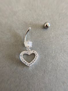 Sterling Silver CZ Heart Belly Button Rings, Navel Piercing,Belly Barbell, Belly Button Jewelry, Belly Piercing - Sterling Silver Color : Silver Material : CZ Heart - Sterling Silver / Barbell - Surgical Steel CZ Heart Size : 14mm / Barbell Size : 15mm /Ball Size : 4mm Gauge: 14 Gauge (Approx 1.6 mm) * Metal components are Sterling Silver. * Suitable for delicate and sensitive skin. * Comes in a jewelry box. If you need extra boxes for gifting....just let us know! Silver Heart Belly Rings For Valentine's Day, Adjustable Silver Heart Piercings, Valentine's Day Silver Heart Belly Rings, Belly Button Jewelry, Navel Piercing, Button Rings, Belly Piercing, Button Jewelry, Belly Rings