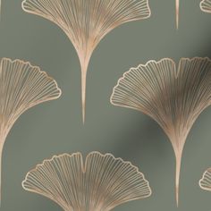 a green and gold wallpaper with large fan shaped leaves