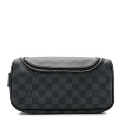 This is an authentic LOUIS VUITTON Damier Graphite Toiletry Pouch. This functional toiletry pouch from Louis Vuitton crafted of sturdy black and gray damier patterned coated canvas. This piece features a side strap and polished silver hardware. This pouch opens to a black leather interior with a zipper pocket and elastics to hold your travel essentials. Louis Vuitton Toiletry Pouch, Louis Vuitton Pouch, Toiletry Pouch, Polish Silver, Travel Pouch, Cosmetic Case, Black And Gray, Leather Interior, Authentic Louis Vuitton